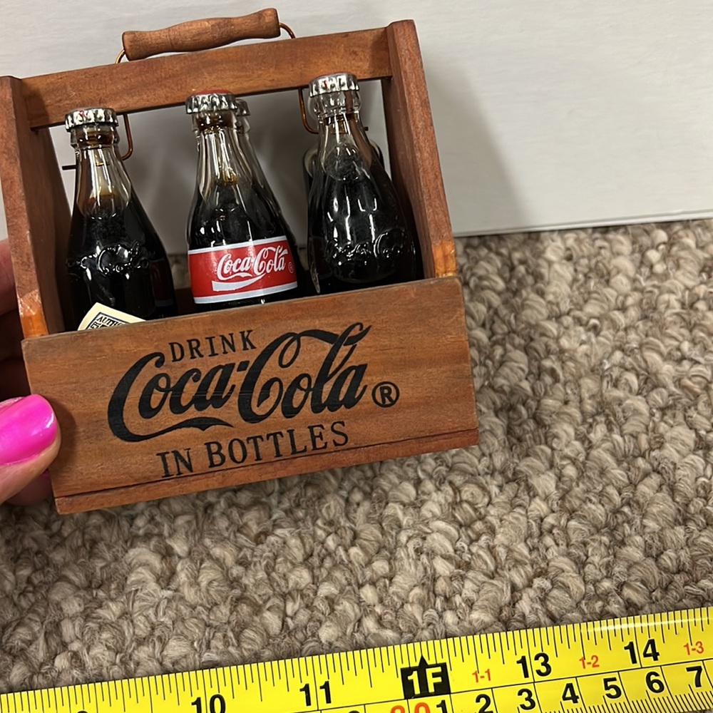 Vintage Coca-Cola bottles and carrier